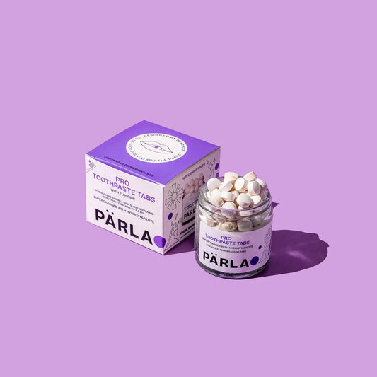 Jar and box of Parla products on a purple background